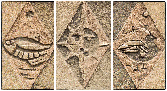 collage of three panels in the exterior wall of a building