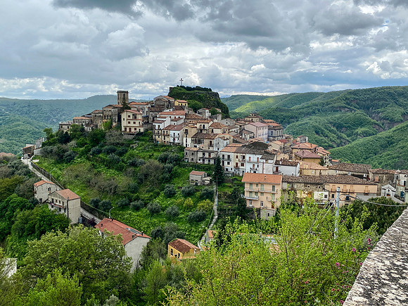 the town spills down the other side of the mountain