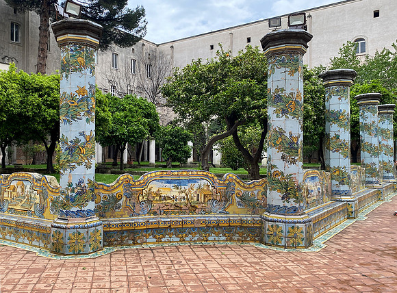 At the cloisters of Santa Chiara benches and columns are covered in majolica tiles.