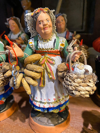 a village woman selling bread - the detail is amazing! She's only about 3 inches tall).