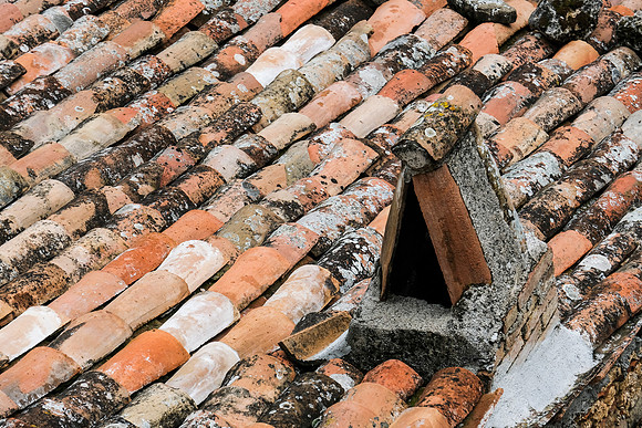 the rooftop and chimney on the house below our room