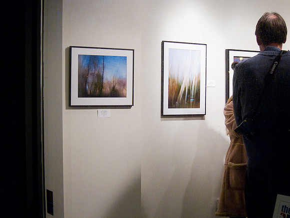 My photos hanging in window of SOAG, Ithaca 2011