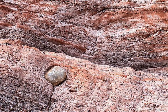 between a rock and a hard place
