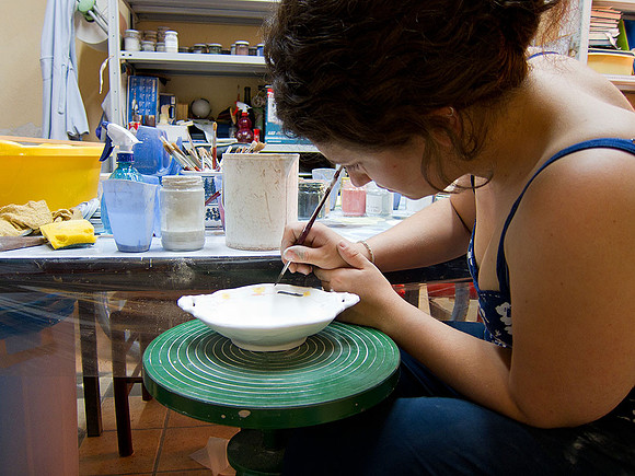 Artisan at work making hand painted ceramics in Cerreta Sannita