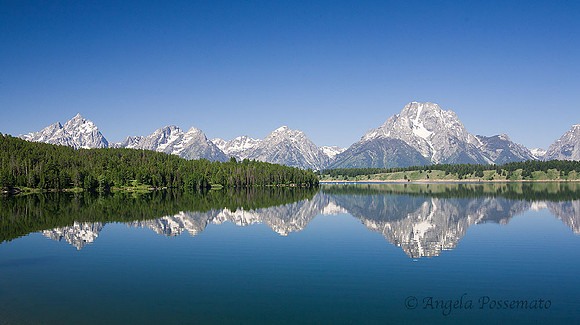 the Tetons seen from the reservoir bridge near Oxbow Bend